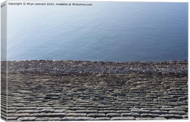 Half bright sunny blue water and half stone reservoir wall texture Canvas Print by Rhys Leonard