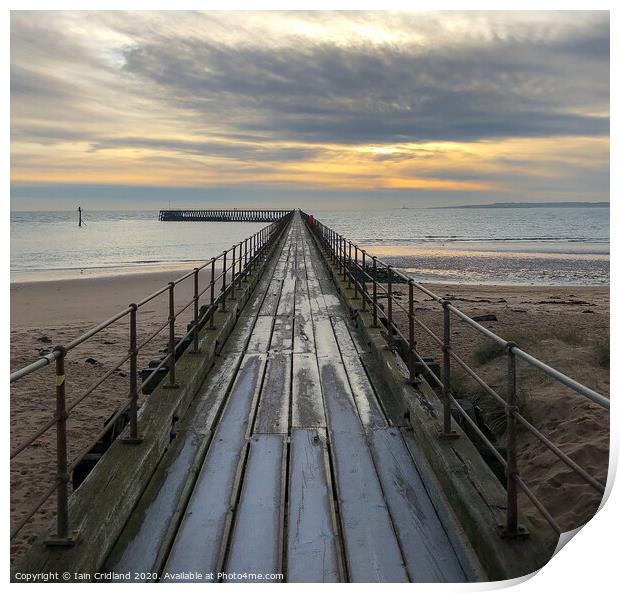A pier heading out to sea Print by Iain Cridland