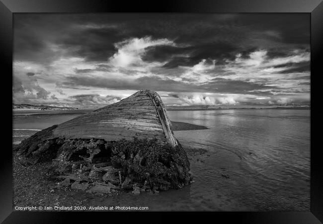 Shipwreck on a beach. Framed Print by Iain Cridland
