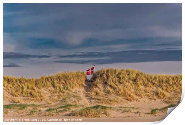 Danish flag waving behind dunes on Blaavand Beach, Denmark Print by Frank Bach