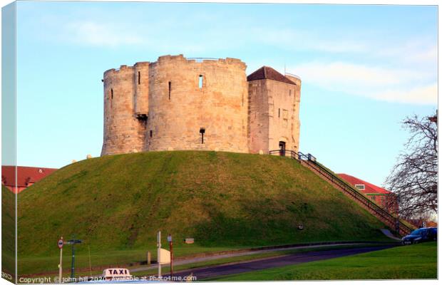 Clifford's tower of York castle in Yorkshire.  Canvas Print by john hill