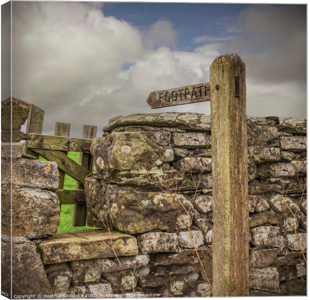 Footpath sign, stile and drystone wall Canvas Print by Heather Sheldrick