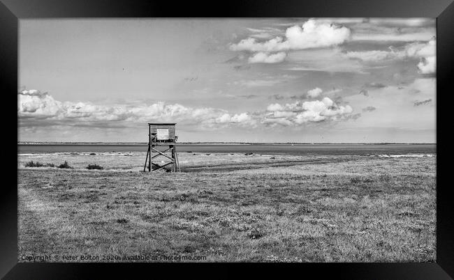 Black and white landscape of coastal nature reserve with an observation hide. At Bradwell, Essex. Framed Print by Peter Bolton