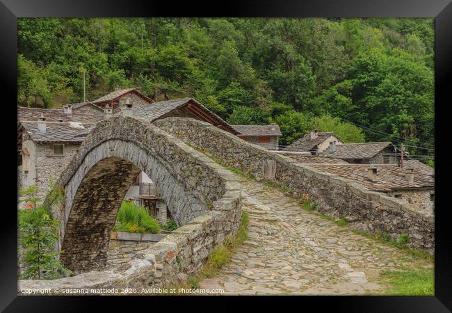  a  vintage  bridge  of an Italian alpine village Framed Print by susanna mattioda