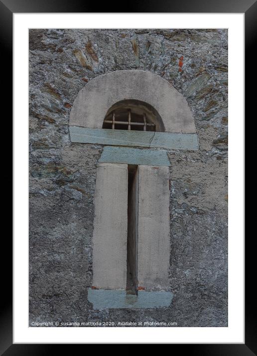 a slit  with security grating of an ancient castle Framed Mounted Print by susanna mattioda