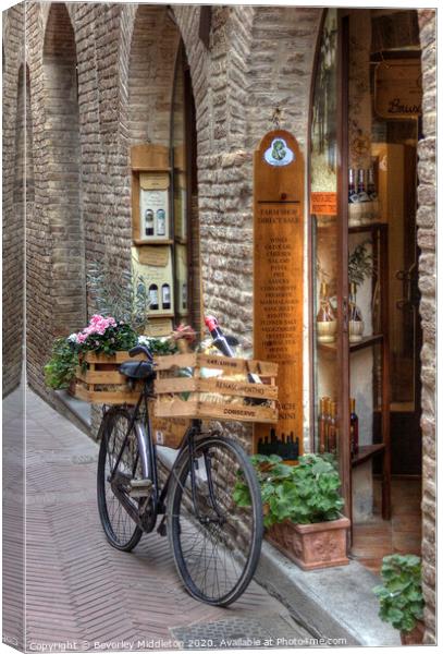 Delivery bike outside Italian Deli Canvas Print by Beverley Middleton
