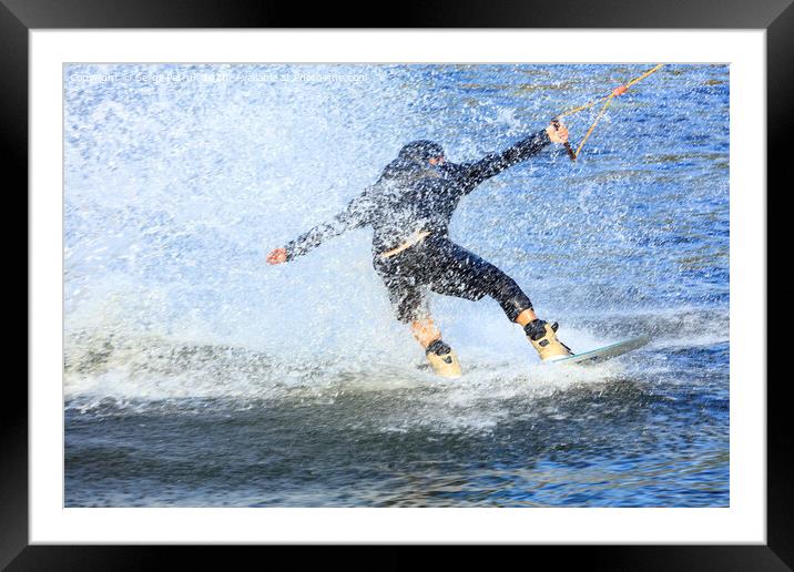 Wakeboarder rushing through the water at high speed Framed Mounted Print by Sergii Petruk