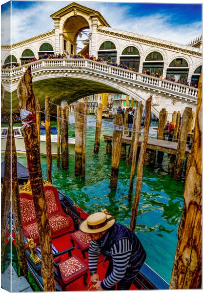 The Rialto Bridge On The Grand Canal In Venice Canvas Print by Chris Lord