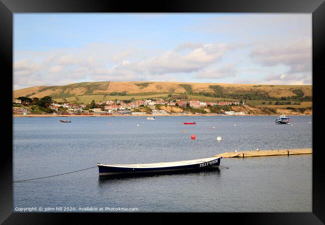 Swanage town from across the bay at Swanage in Dorset. Framed Print by john hill