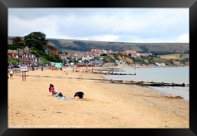 Swanage beach during October in Dorset. Framed Print by john hill