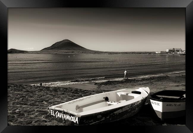 Old boats on the foreshore at El Medano, Tenerife Framed Print by Phil Crean