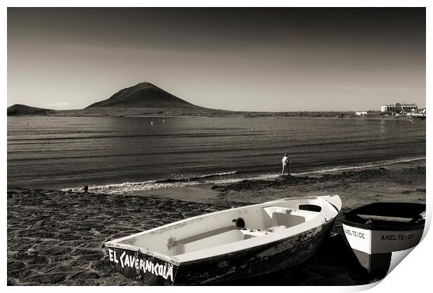 Old boats on the foreshore at El Medano, Tenerife Print by Phil Crean