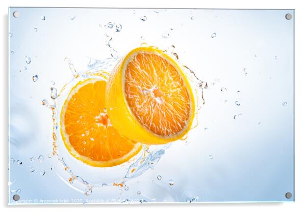 Two halves of orange fruit splashing into clear water. Acrylic by Przemek Iciak