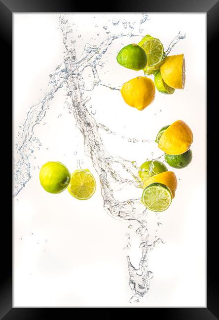 Fresh limes and lemons with water splash in midair, isolated on white background Framed Print by Przemek Iciak