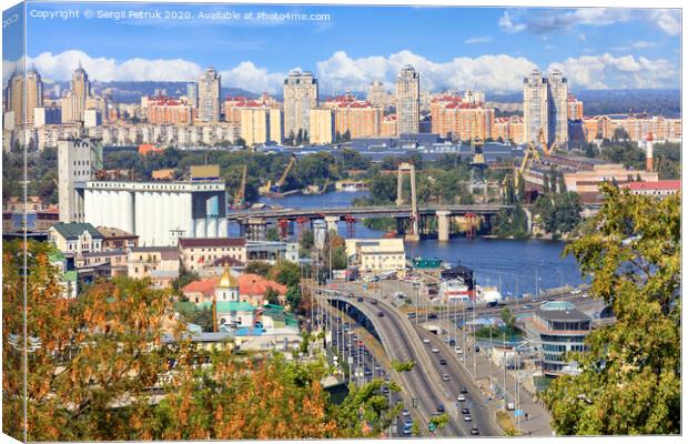 The landscape of the autumn city of Kyiv with a view of the Dnipro River, many bridges, the old Podilsky district and new houses on Obolon. Canvas Print by Sergii Petruk