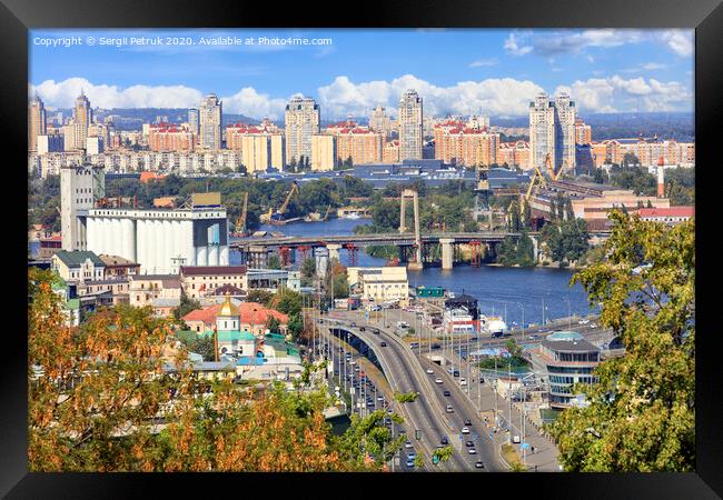 The landscape of the autumn city of Kyiv with a view of the Dnipro River, many bridges, the old Podilsky district and new houses on Obolon. Framed Print by Sergii Petruk
