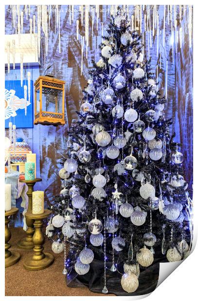 Christmas toys and stars, Christmas tinsel, decorative icicles and blue lights hang on a Christmas tree. Print by Sergii Petruk