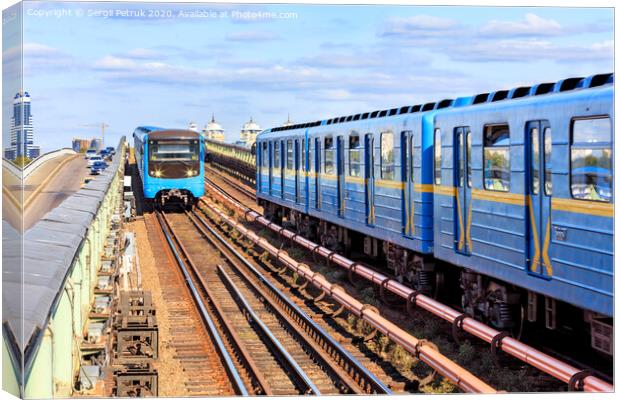 Two metro trains go towards each other along the metro bridge in Kyiv across the Dnipro River. Canvas Print by Sergii Petruk