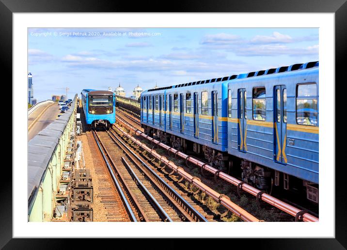 Two metro trains go towards each other along the metro bridge in Kyiv across the Dnipro River. Framed Mounted Print by Sergii Petruk
