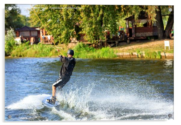 A wakeboarder rushes through the water at high speed along the green bank of the river. Acrylic by Sergii Petruk