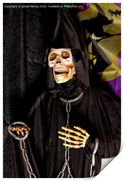 Halloween, death doll in a black hoodie with metal chains and shackles on his hands. Print by Sergii Petruk