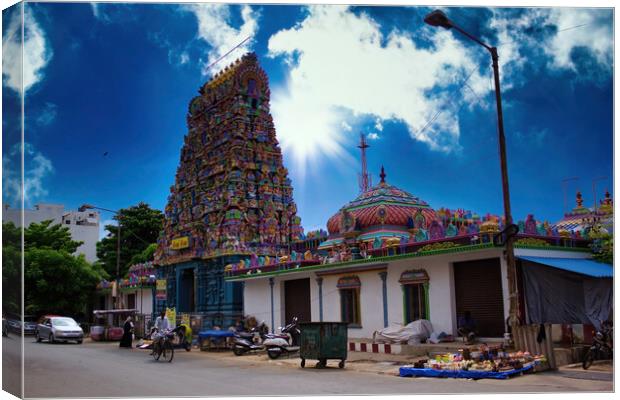 Pondicherry, India -: Wide angle shot of An Indian colorful temple named Vedapureeswarar exterior displaying beautiful hindu architecture with gods sculpture carved on it's built. Canvas Print by Arpan Bhatia