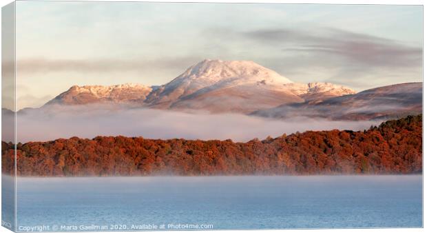 Autumn mist shrouded between Mountain and Loch Canvas Print by Maria Gaellman