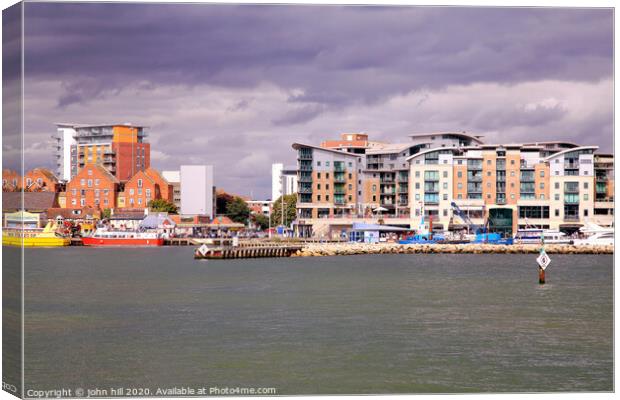 The quayside taken from a ferry at Poole harbour in Dorset Canvas Print by john hill