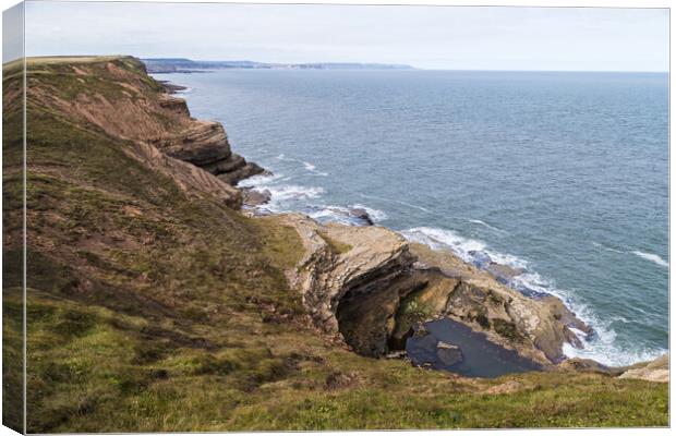 Large pool of water in Filey Brigg Canvas Print by Jason Wells