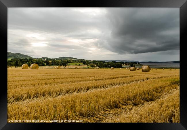 "Dramatic Autumn Harvest: Stormy Barley Straw Bale Framed Print by Mike Byers