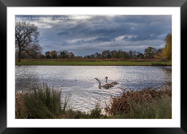 Dramatic sky over pond Framed Mounted Print by Kevin White