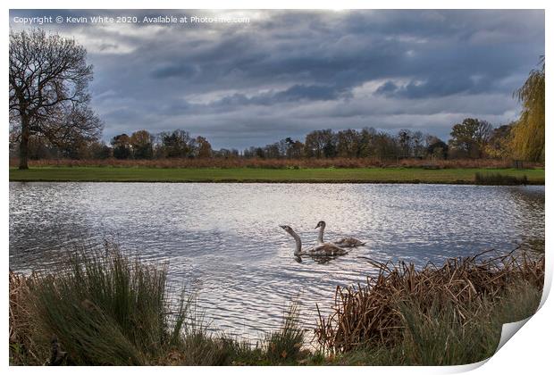 Dramatic sky over pond Print by Kevin White