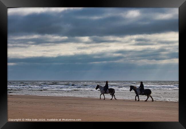 Horseriders on a Winter Beach Framed Print by Mike Dale