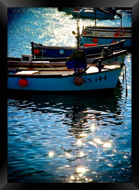 Small boats at anchor in St. Ives harbour with sun light and shadows. Cornwall. Framed Print by Peter Bolton