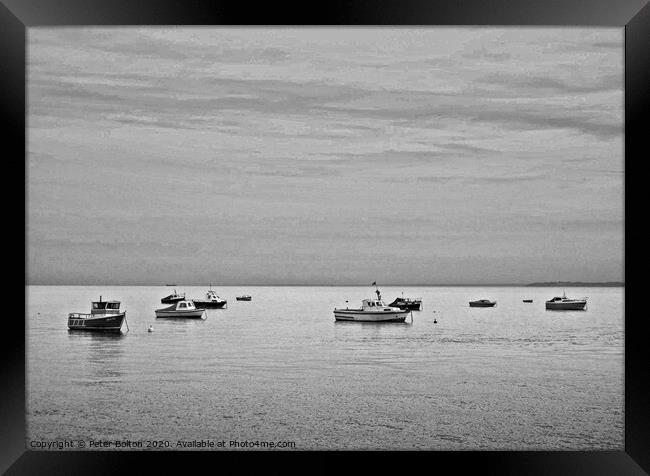 Black and white study of small boats at anchor offshore at Thorpe Bay, Essex. Framed Print by Peter Bolton