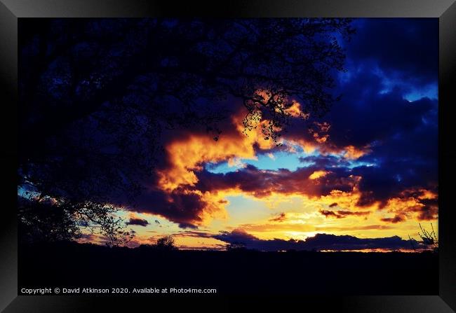 Fire in the sky Framed Print by David Atkinson