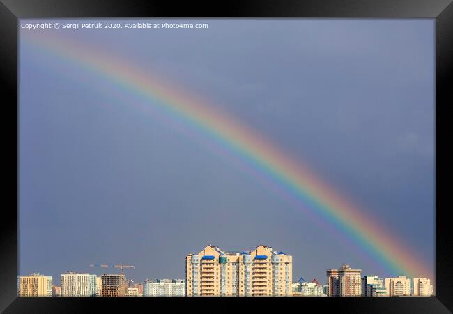 Rainbow in the sky above the city after a thunderstorm. Framed Print by Sergii Petruk
