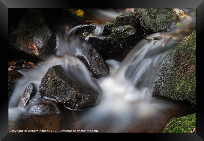 Long exposure of a fast flowing River Rivelin near Framed Print by Richard Ashbee