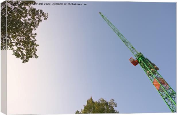 Abstract looking up at the underside of a huge tower crane and trees Canvas Print by Rhys Leonard
