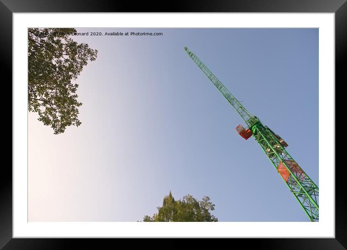 Abstract looking up at the underside of a huge tower crane and trees Framed Mounted Print by Rhys Leonard