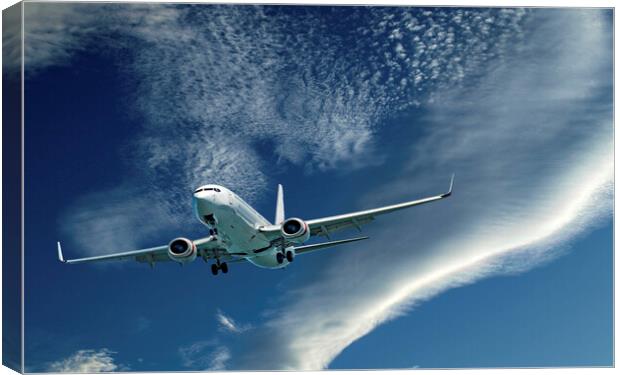 Commercial aircraft flying in cloud. Canvas Print by Geoff Childs