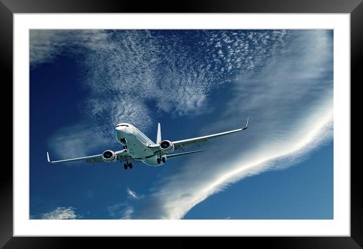 Commercial aircraft flying in cloud. Framed Mounted Print by Geoff Childs