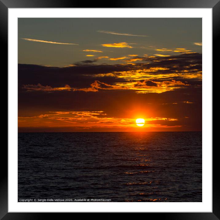 sunset over the sea Framed Mounted Print by Sergio Delle Vedove