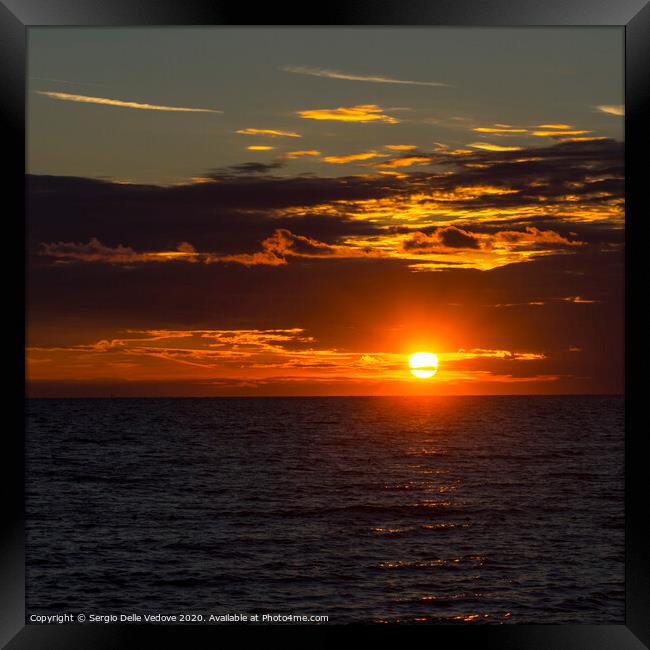 sunset over the sea Framed Print by Sergio Delle Vedove