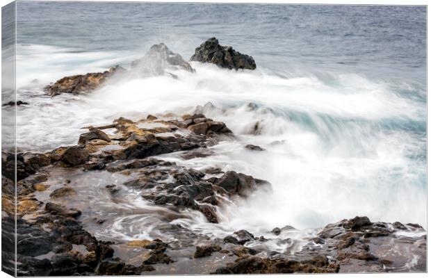 Ocean swirling over rocks Tenerife Canvas Print by Phil Crean
