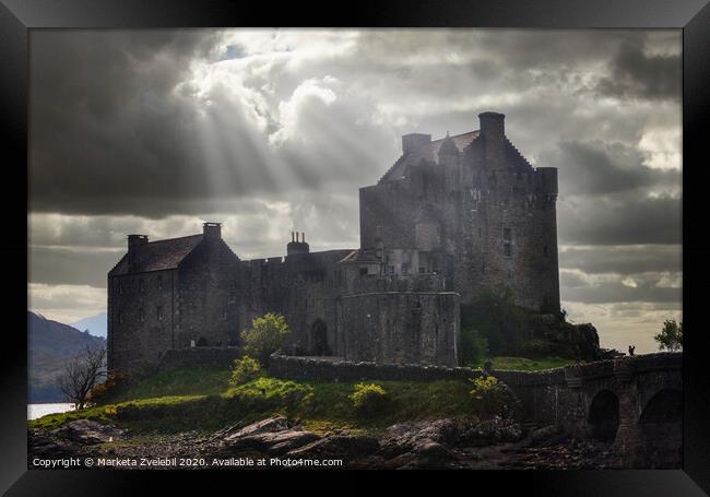 Eilean Donan castle in a burst of sun Framed Print by Marketa Zvelebil