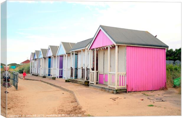 Wooden beach huts at Sandilands near Sutton on Sea in Lincolnshire. Canvas Print by john hill