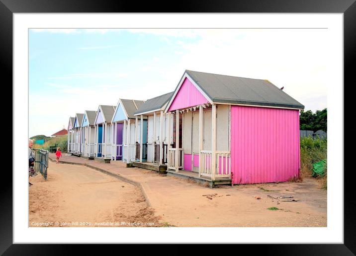 Wooden beach huts at Sandilands near Sutton on Sea in Lincolnshire. Framed Mounted Print by john hill
