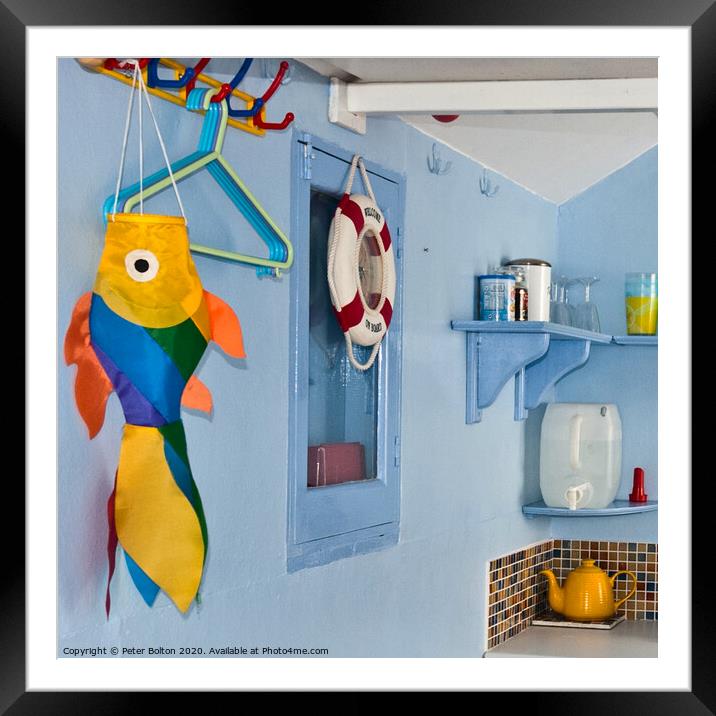 Inside corner of a beach hut. Colourful still life. Framed Mounted Print by Peter Bolton