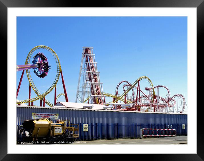 Fantasy Island entertainment silhouetted against a blue sky. Framed Mounted Print by john hill